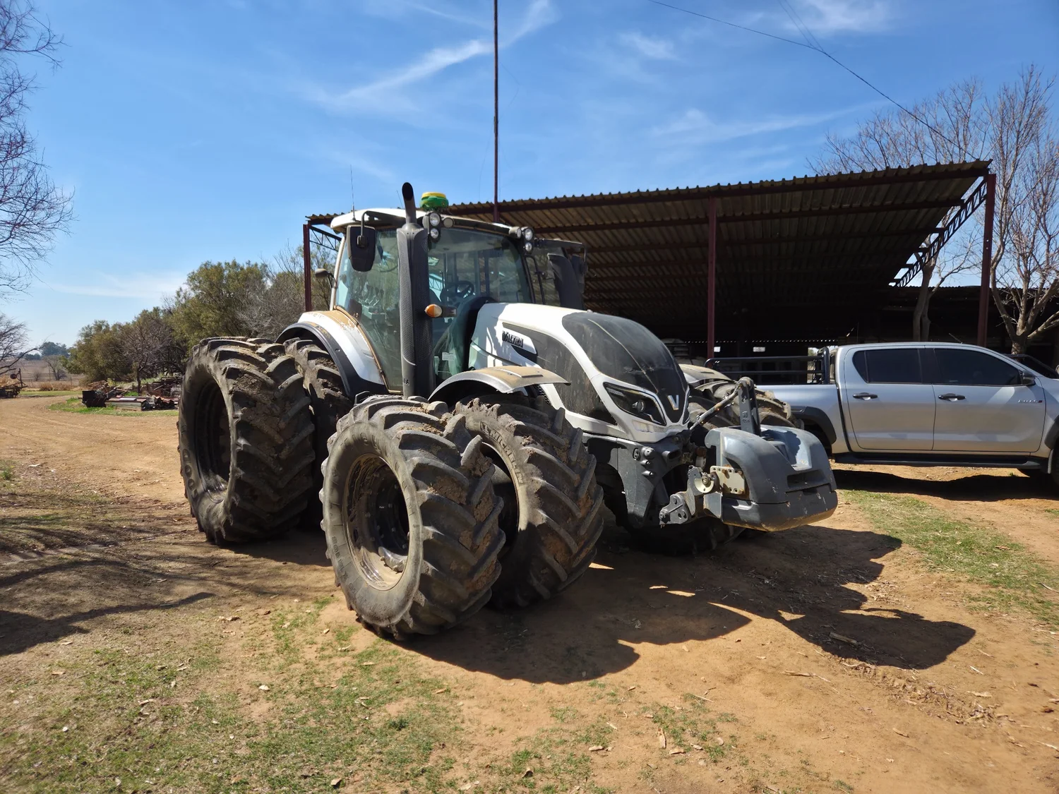 White Valtra tractor with dual wheels